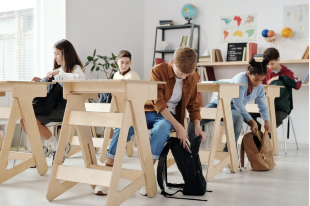 School children at their desks in clean modern classroom