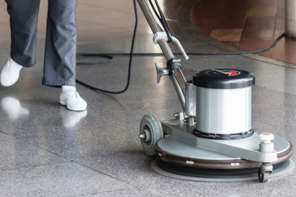 Professional using a floor polishing machine